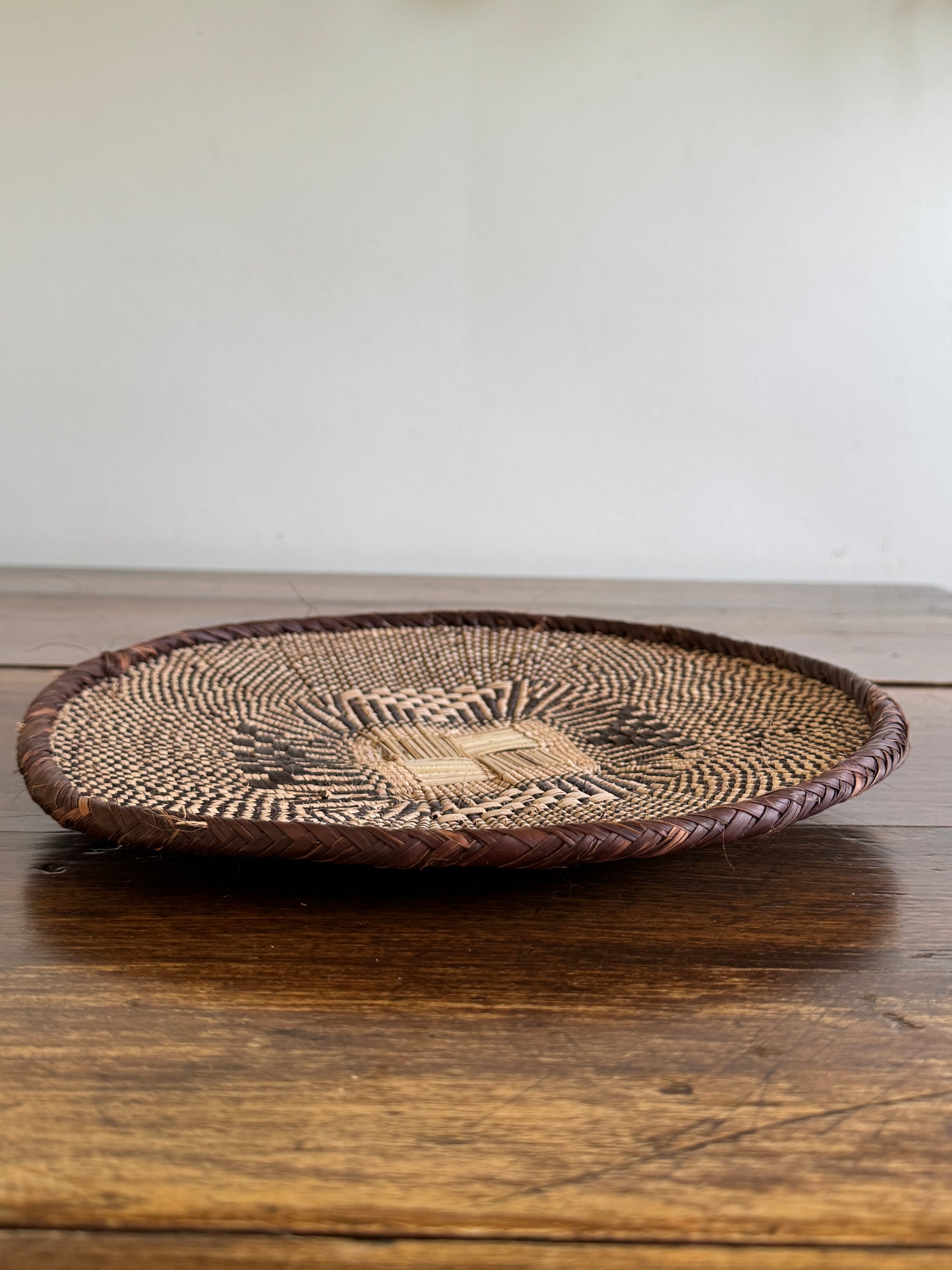 Vintage Woven African Flat Style Basket with Detailed Weaving Design