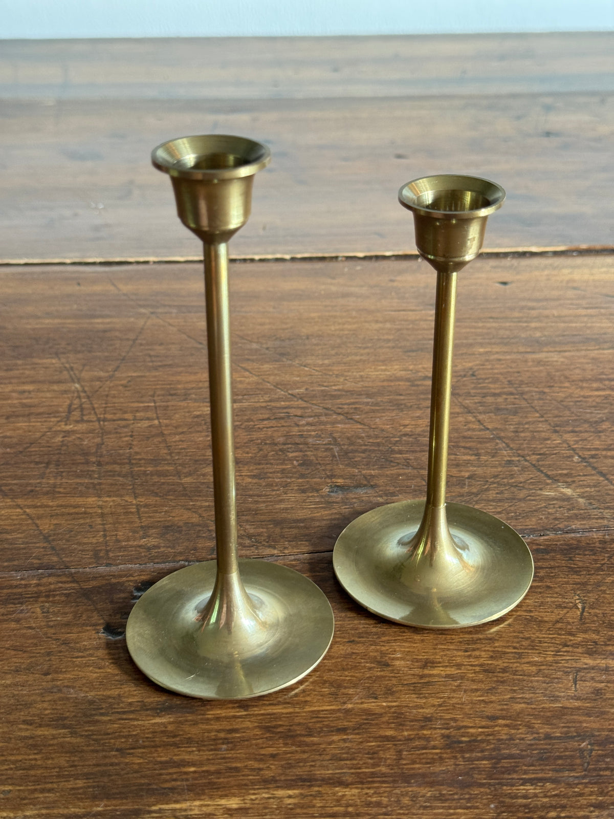 Pair of Two Brass Candles with Skinny Posts and Fluted Bottoms