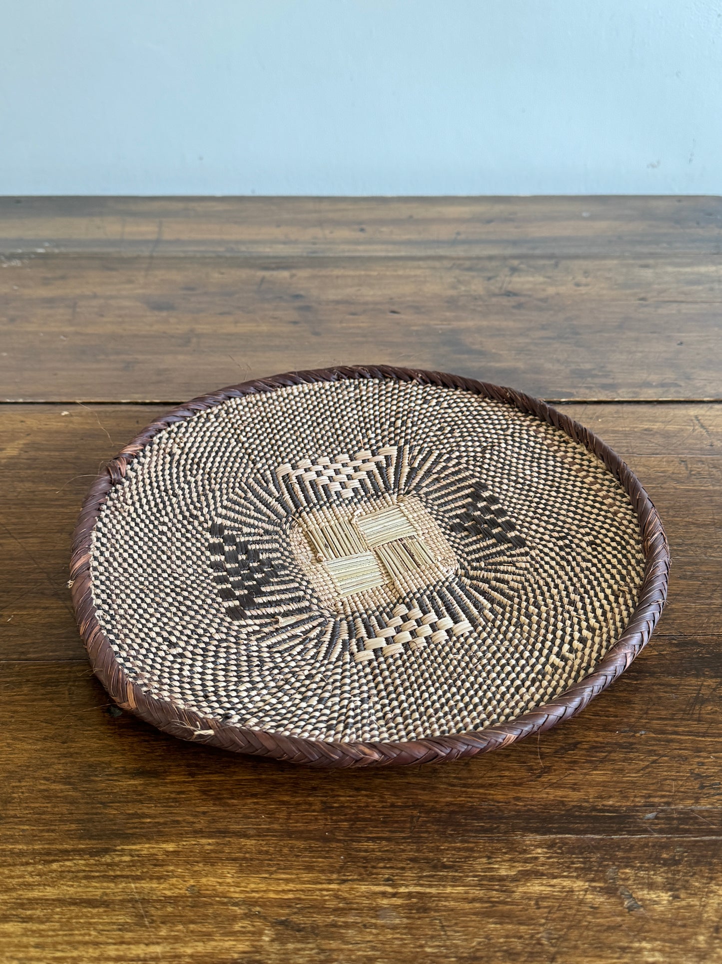 Vintage Woven African Flat Style Basket with Detailed Weaving Design