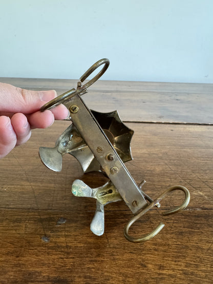 Vintage Brass Frogs Sitting on Bench Under Umbrella