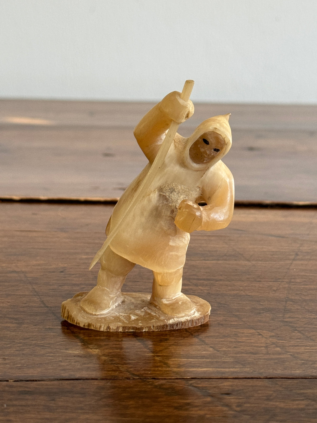Vintage Canadian Horn Carved Seal Hunter Figurine