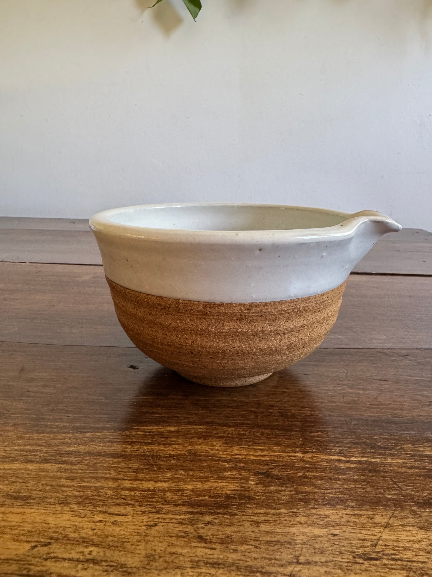 Brown and White Pottery Bowl with Pour Spout