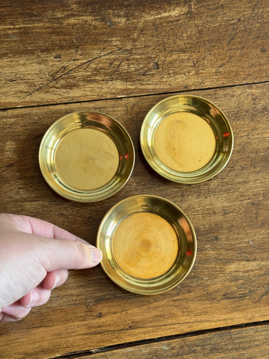 Three Small Brass Dishes with Simple Rolled Edge Design