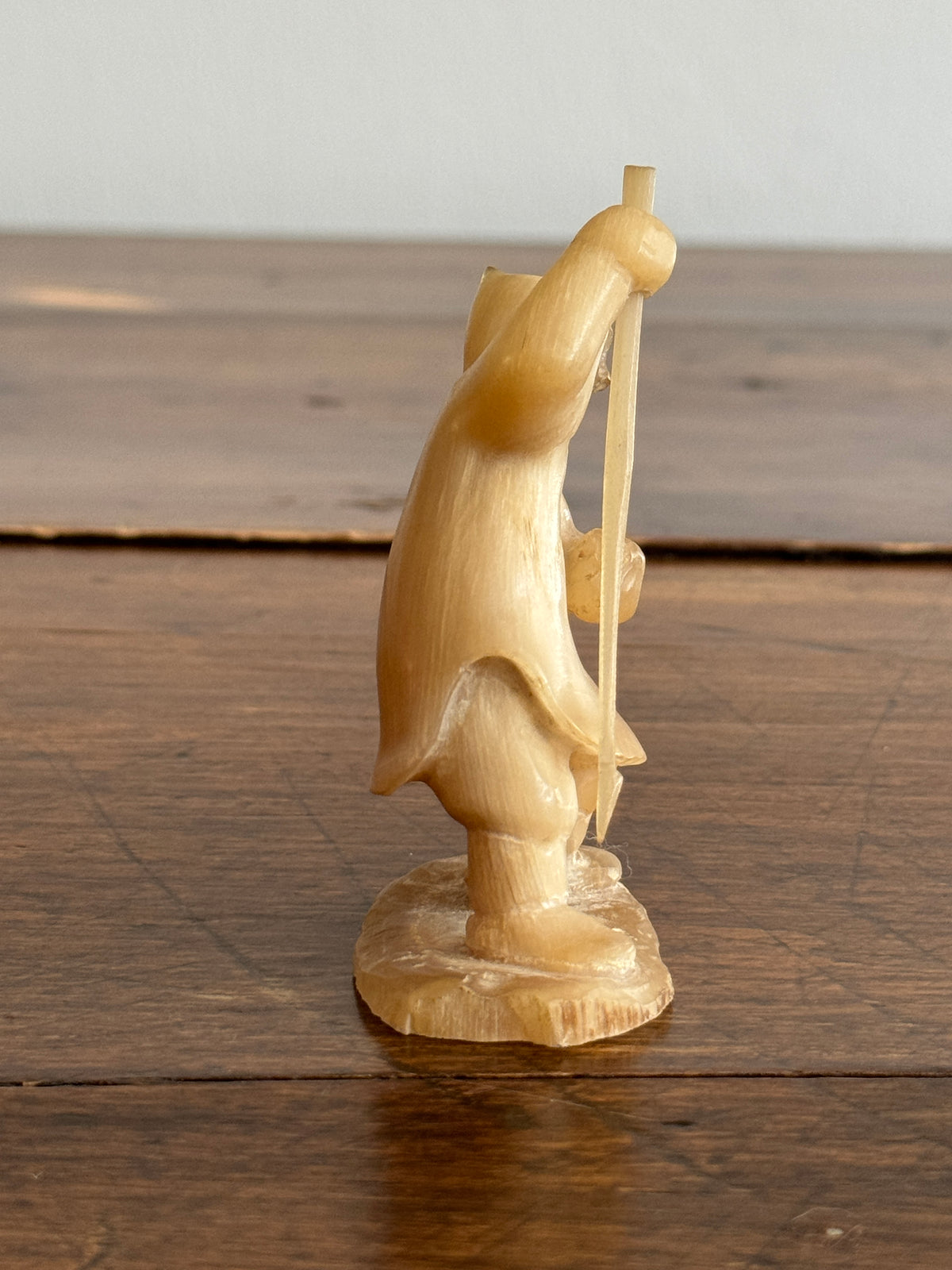 Vintage Canadian Horn Carved Seal Hunter Figurine