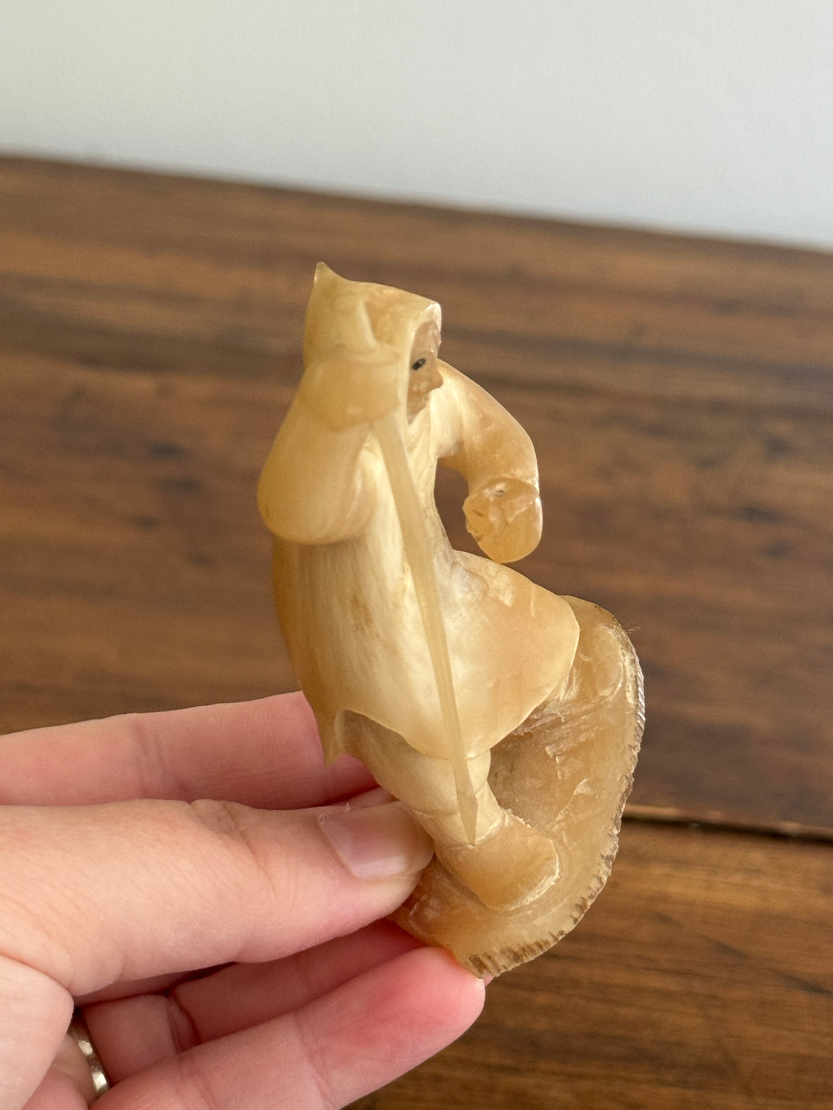 Vintage Canadian Horn Carved Seal Hunter Figurine