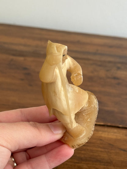 Vintage Canadian Horn Carved Seal Hunter Figurine