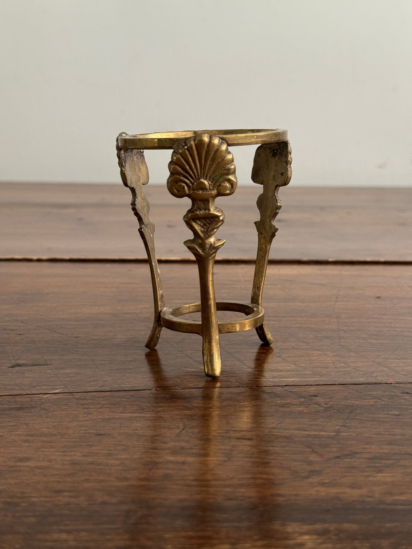 Small Brass Stand with Three Legs and Ornate Detailing