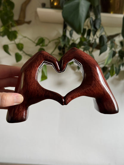 Ceramic Hands Making Heart Shape Figurine