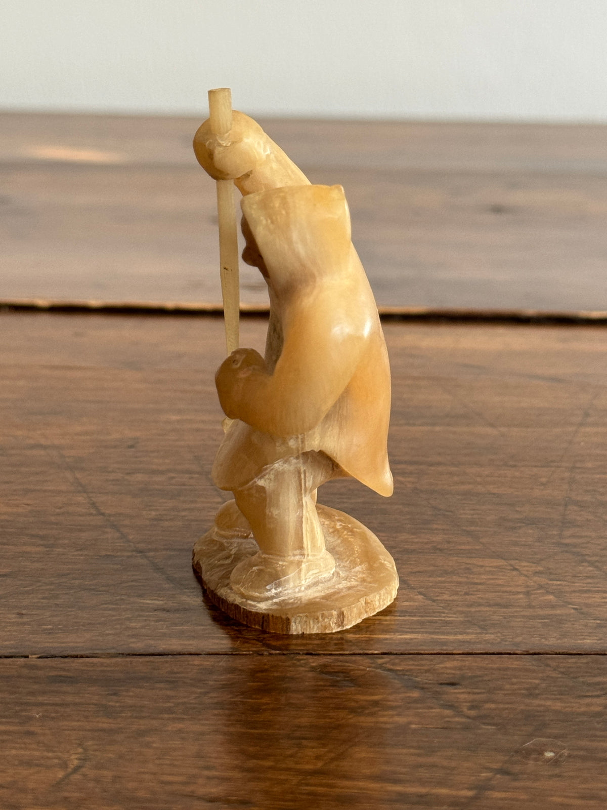 Vintage Canadian Horn Carved Seal Hunter Figurine