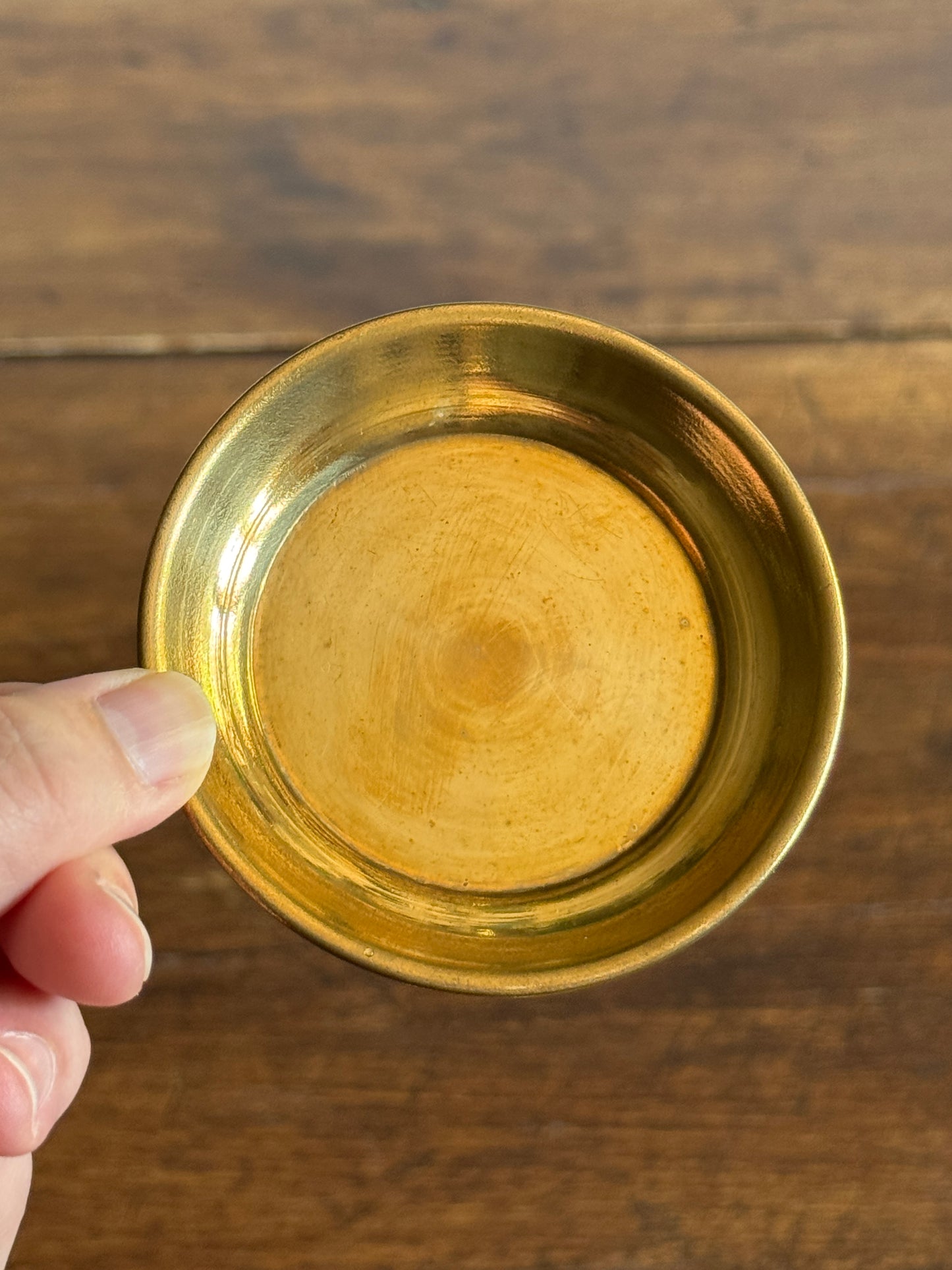 Three Small Brass Dishes with Simple Rolled Edge Design