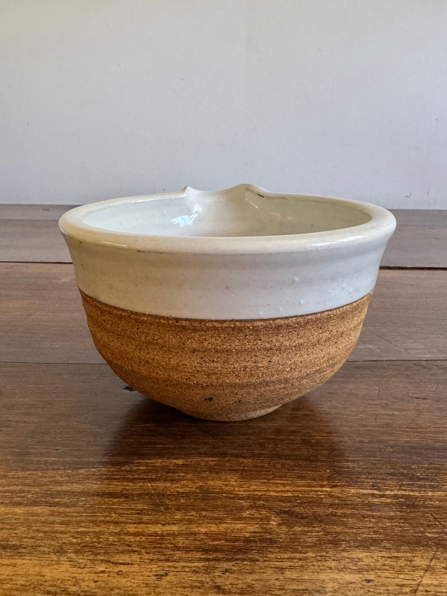 Brown and White Pottery Bowl with Pour Spout