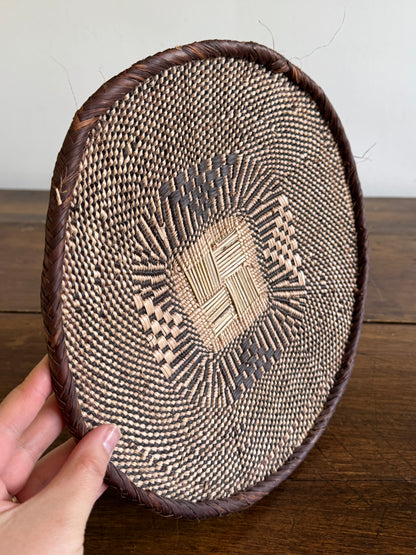 Vintage Woven African Flat Style Basket with Detailed Weaving Design