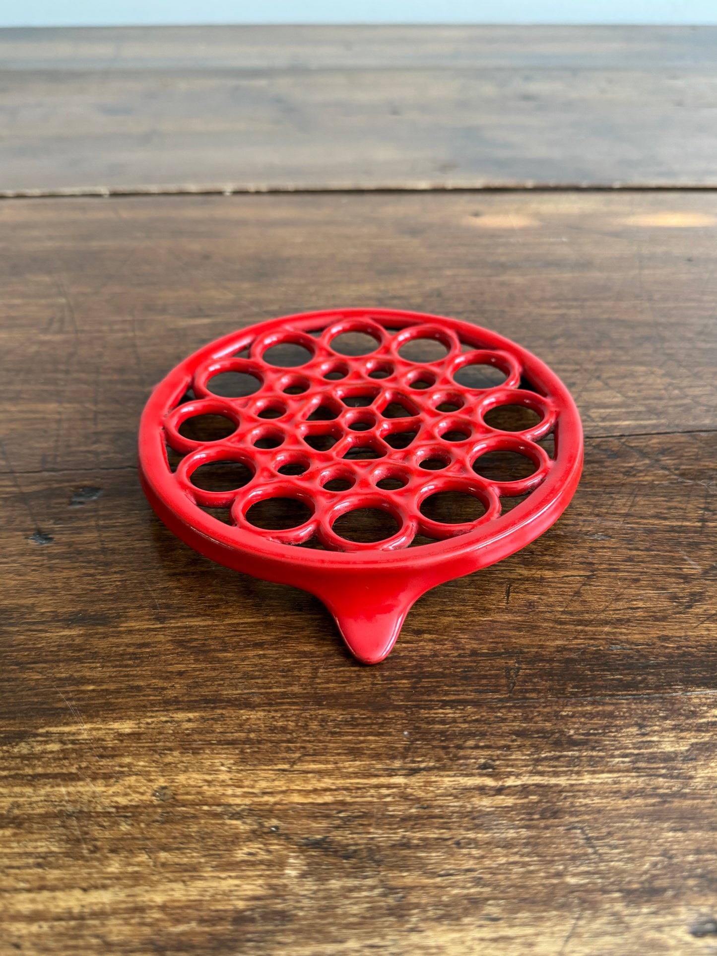 Vintage Red Enamel Cast Iron Trivet