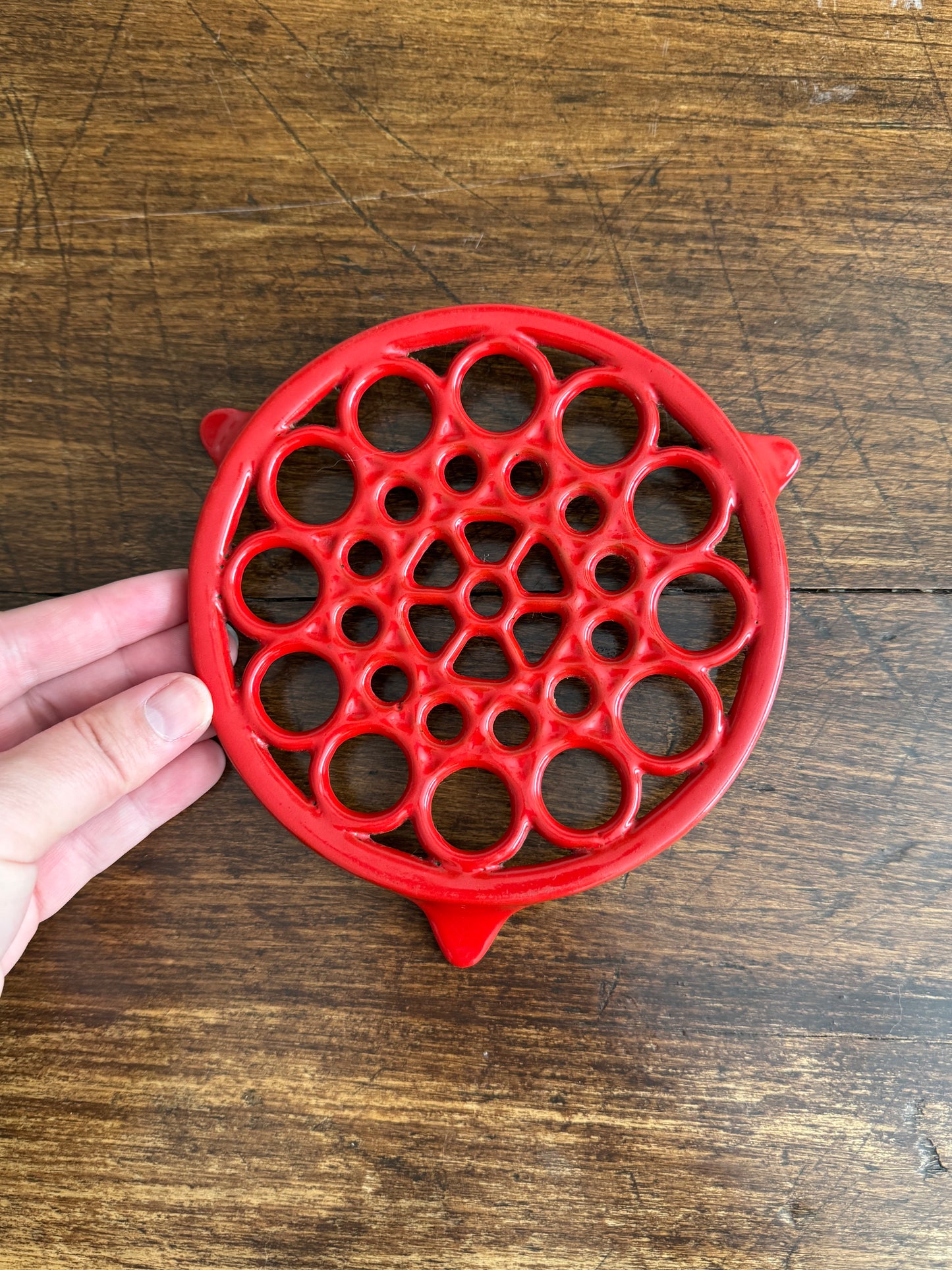 Vintage Red Enamel Cast Iron Trivet