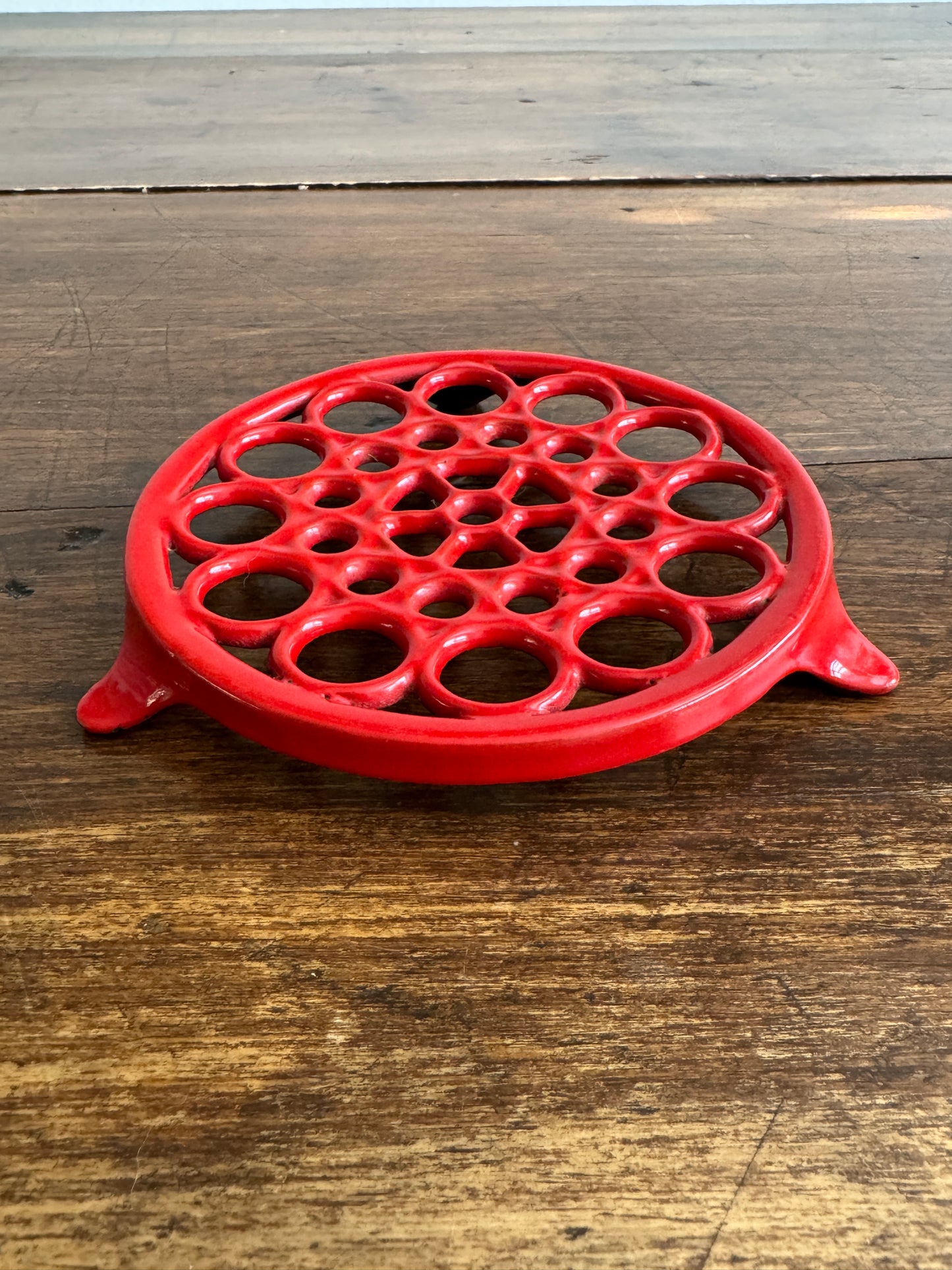 Vintage Red Enamel Cast Iron Trivet