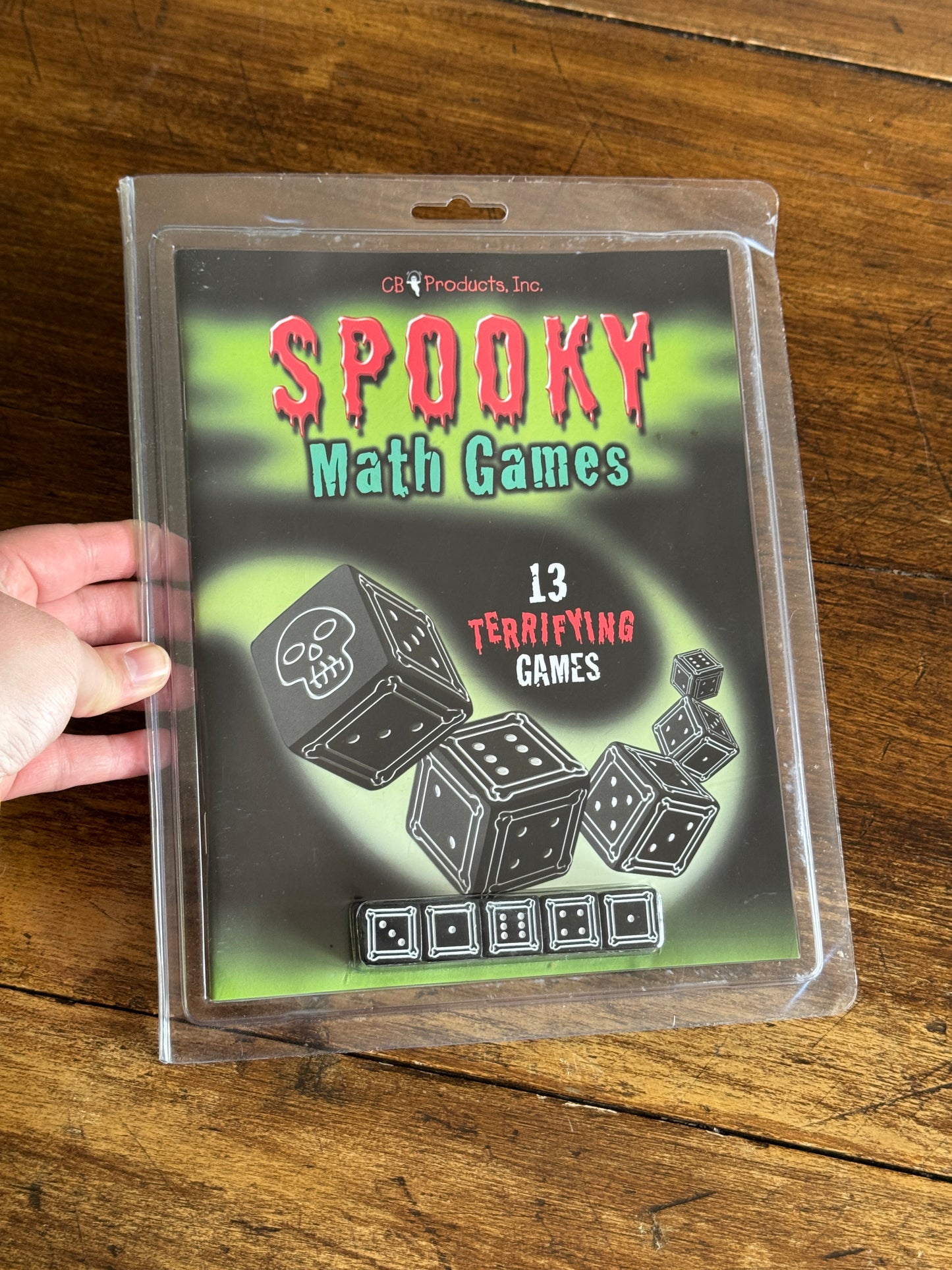Spooky Math Dice Game with Black Dice Showing Skull Symbol