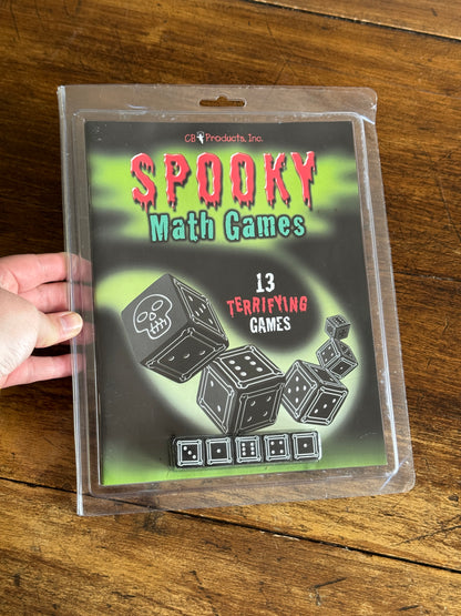 Spooky Math Dice Game with Black Dice Showing Skull Symbol
