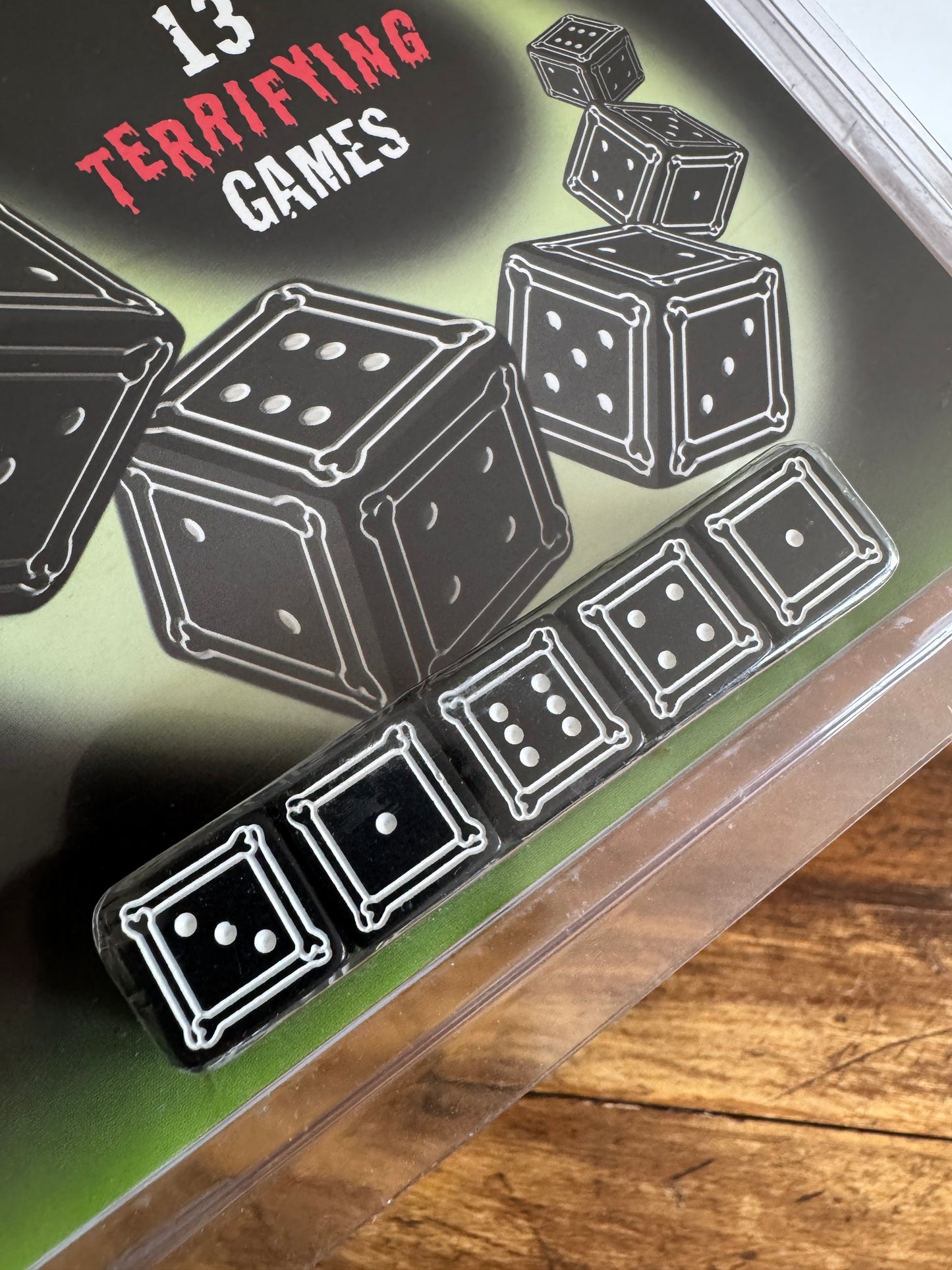 Spooky Math Dice Game with Black Dice Showing Skull Symbol