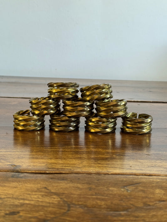 Set of Nine Brass Twisted Metal Napkin Rings