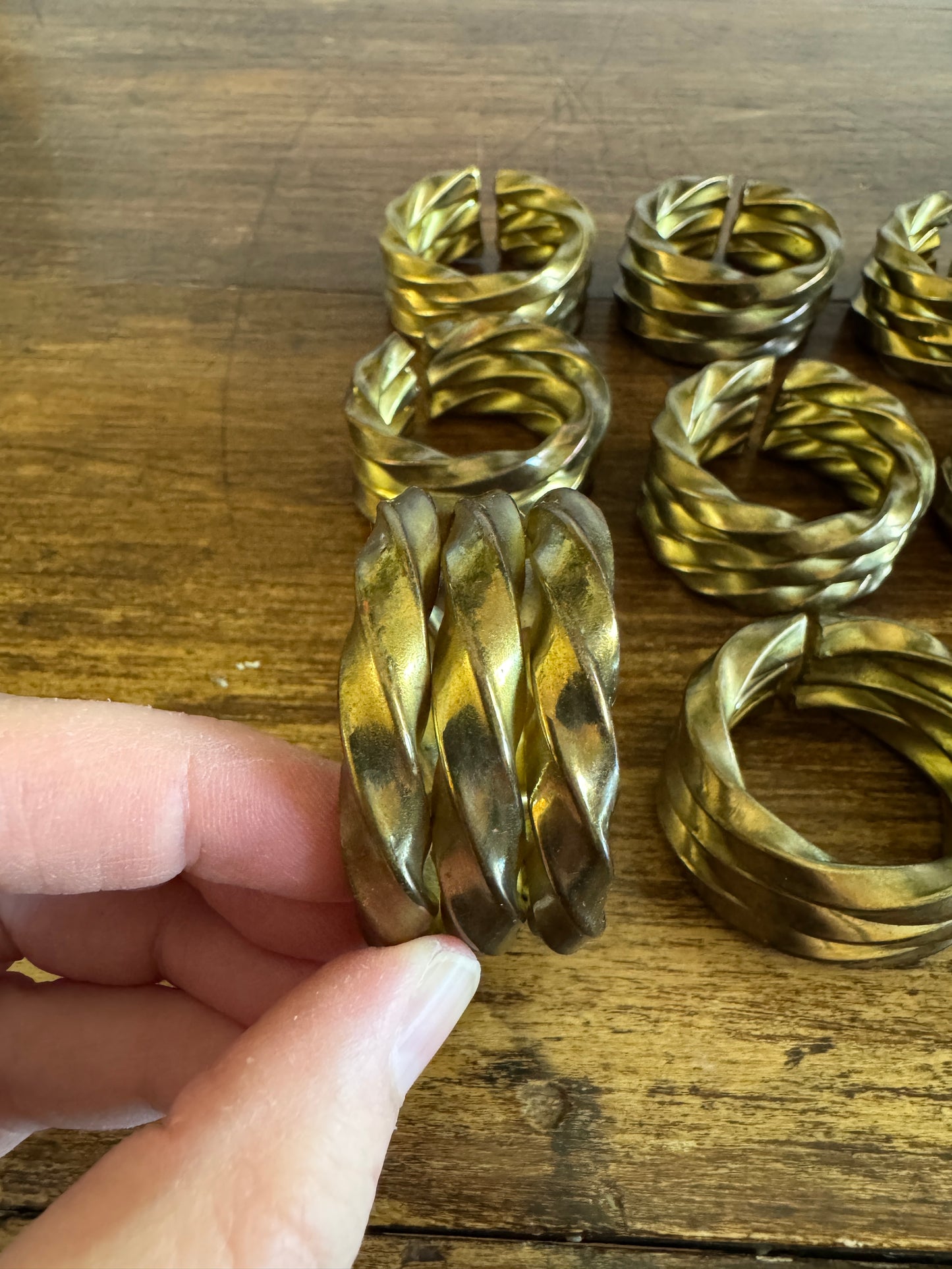 Set of Nine Brass Twisted Metal Napkin Rings