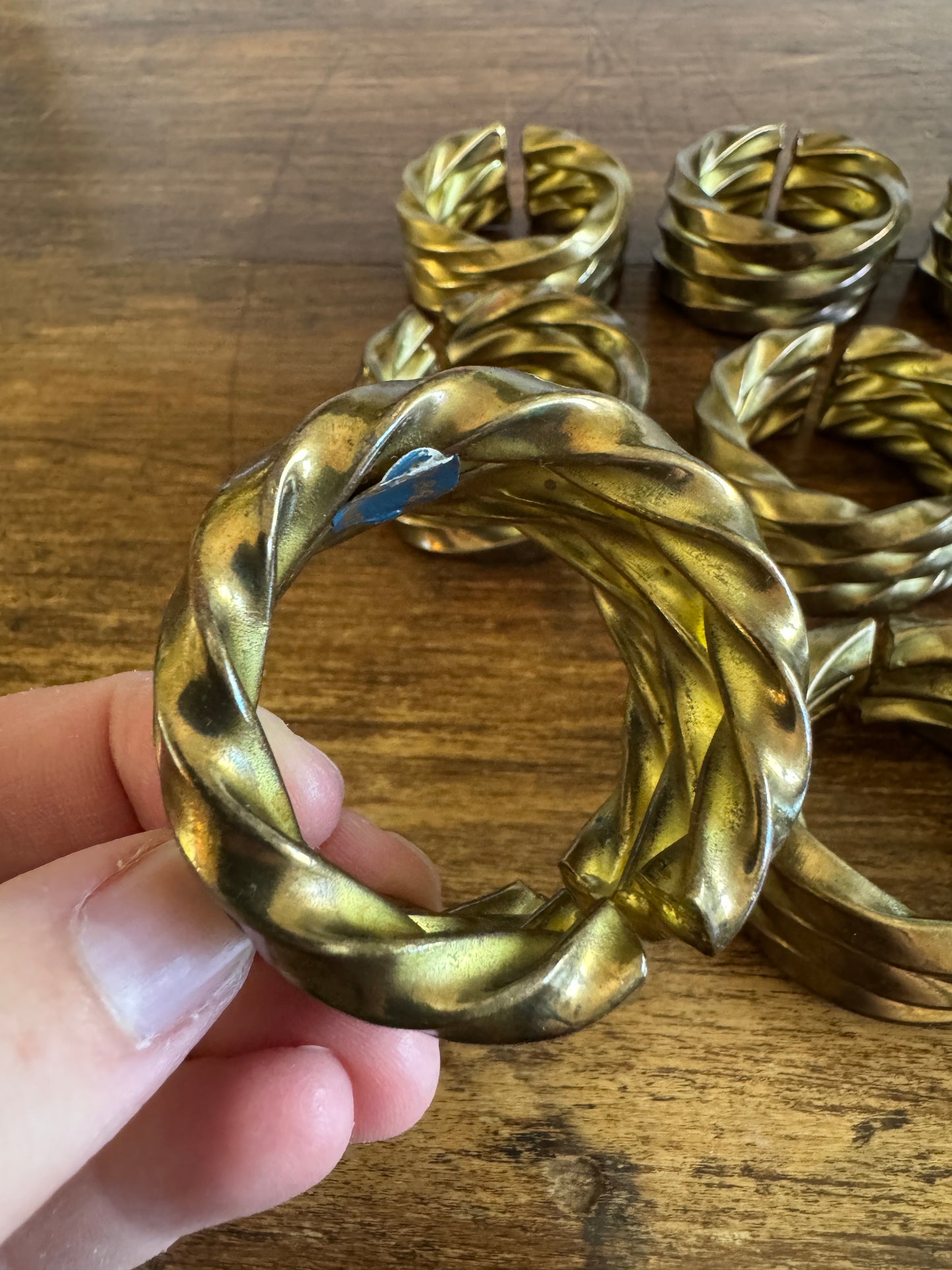Set of Nine Brass Twisted Metal Napkin Rings