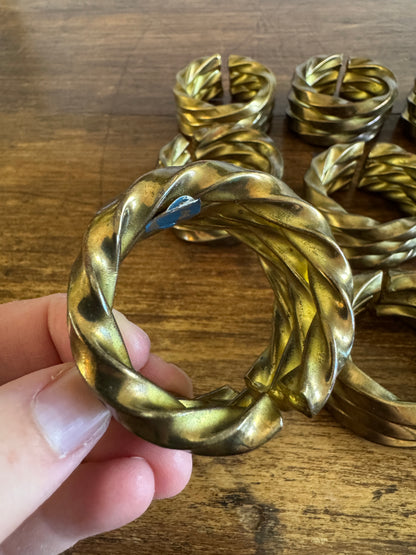 Set of Nine Brass Twisted Metal Napkin Rings