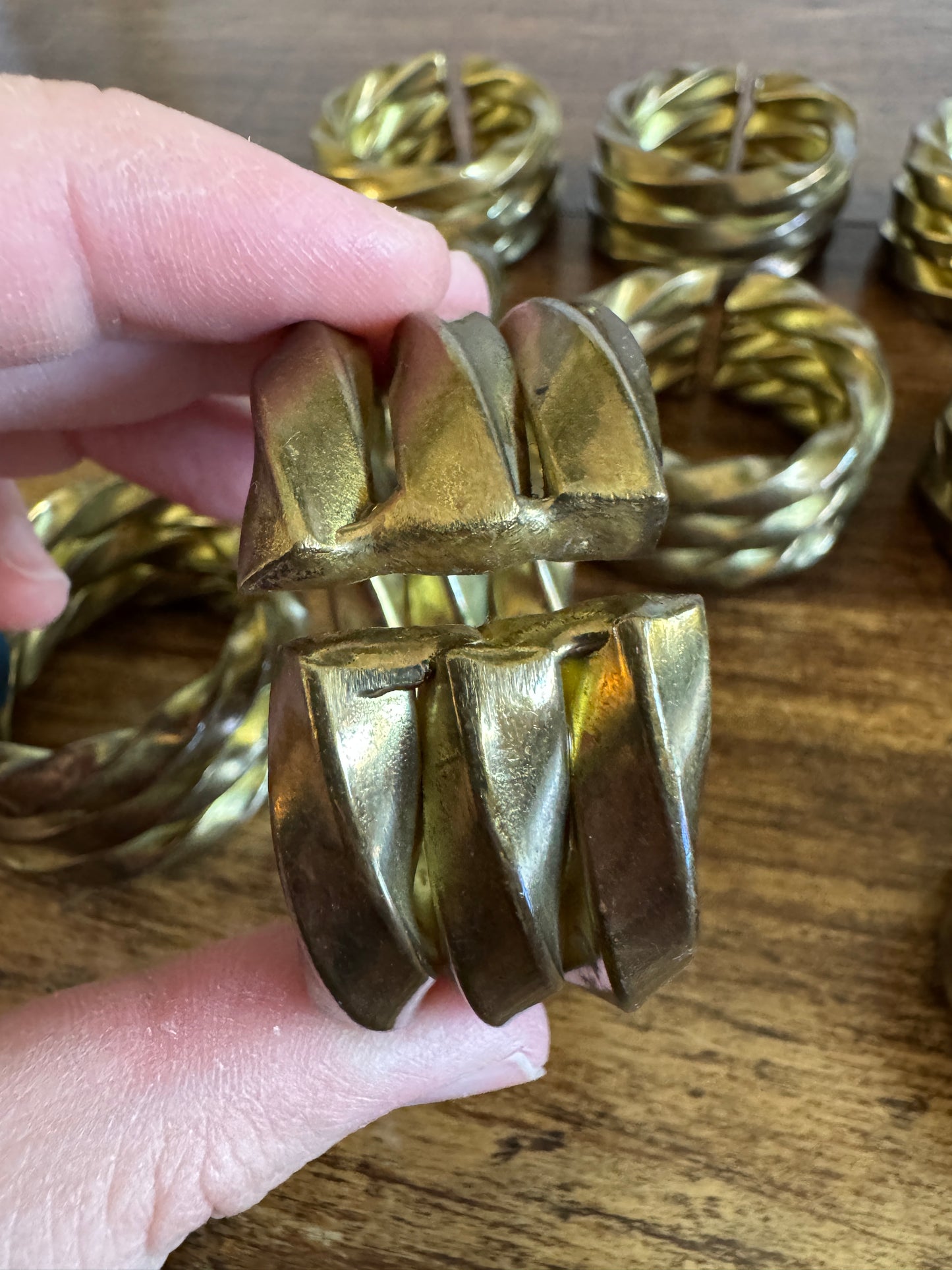 Set of Nine Brass Twisted Metal Napkin Rings