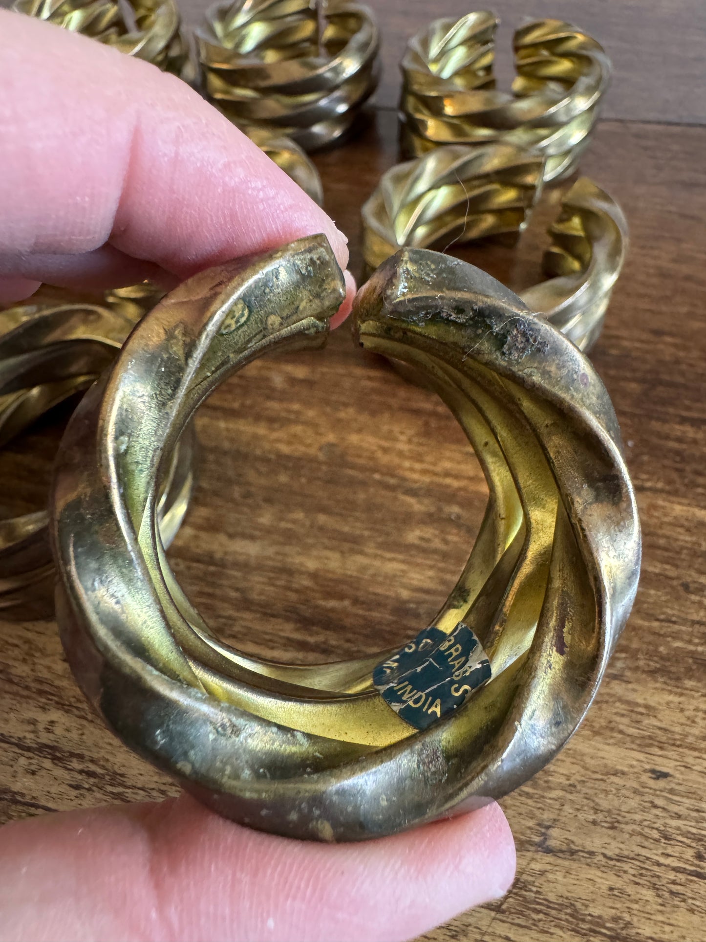 Set of Nine Brass Twisted Metal Napkin Rings