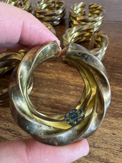 Set of Nine Brass Twisted Metal Napkin Rings