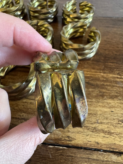 Set of Nine Brass Twisted Metal Napkin Rings