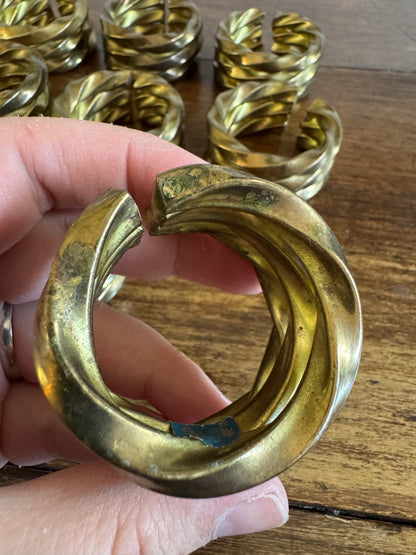 Set of Nine Brass Twisted Metal Napkin Rings