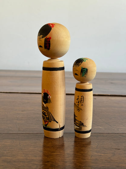 Vintage Pair of Japanese Kokeshi Dolls with Scenic Bodies and Calligraphy