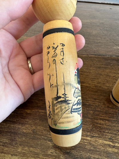 Vintage Pair of Japanese Kokeshi Dolls with Scenic Bodies and Calligraphy