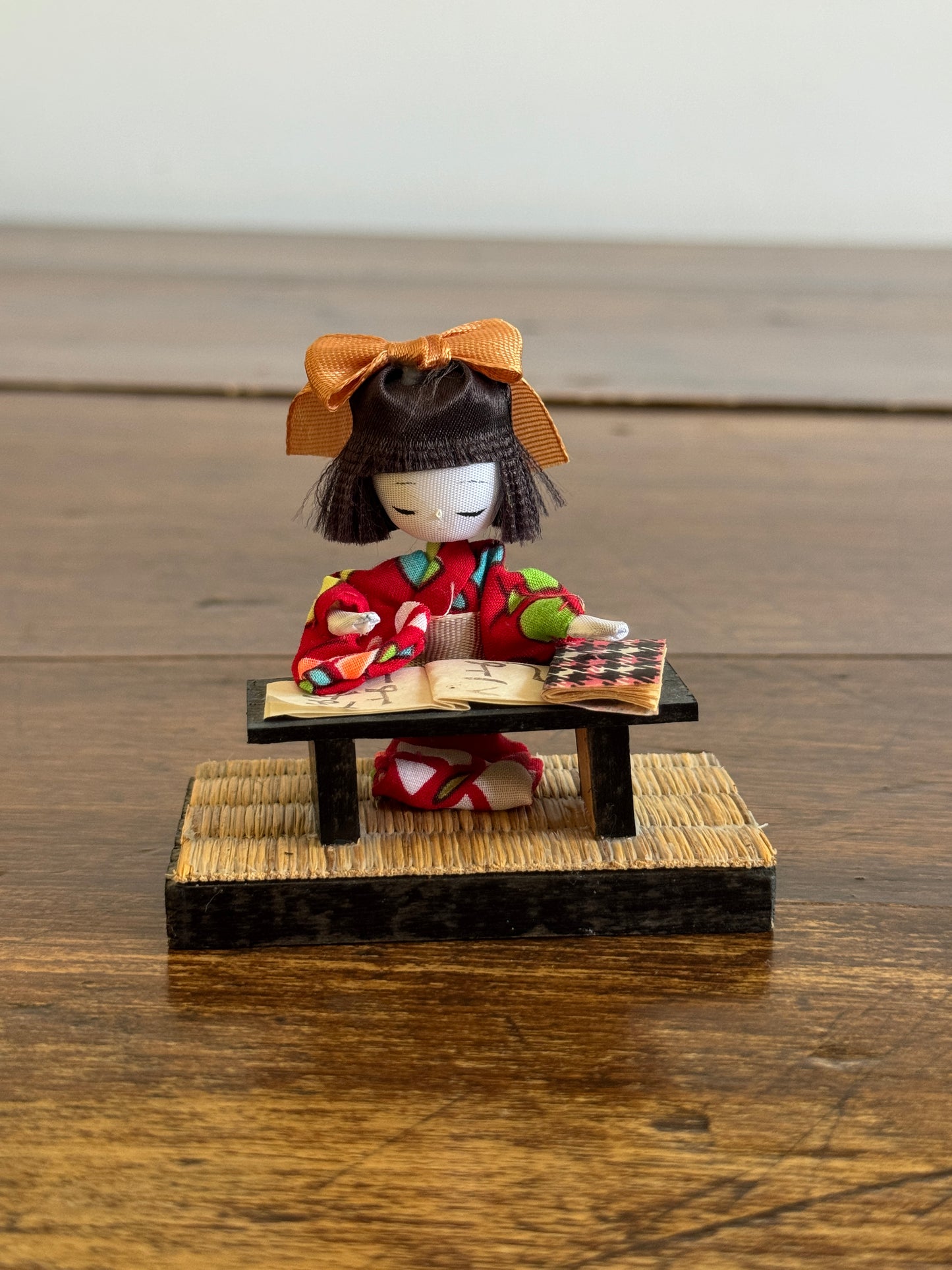 Vintage Japanese Mixed Media Kokeshi Doll on Mat in Learning Environment