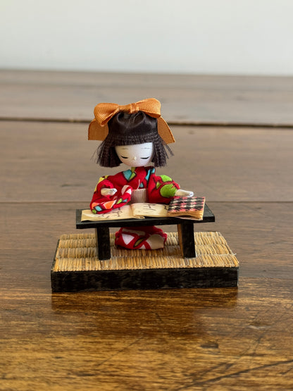 Vintage Japanese Mixed Media Kokeshi Doll on Mat in Learning Environment
