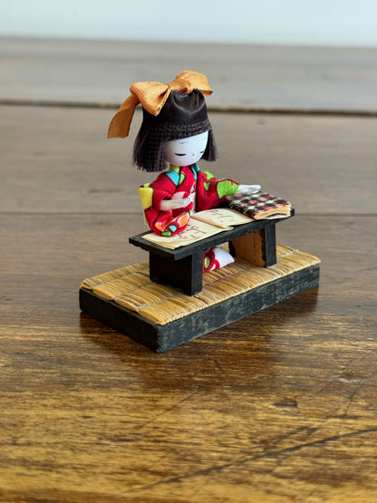 Vintage Japanese Mixed Media Kokeshi Doll on Mat in Learning Environment