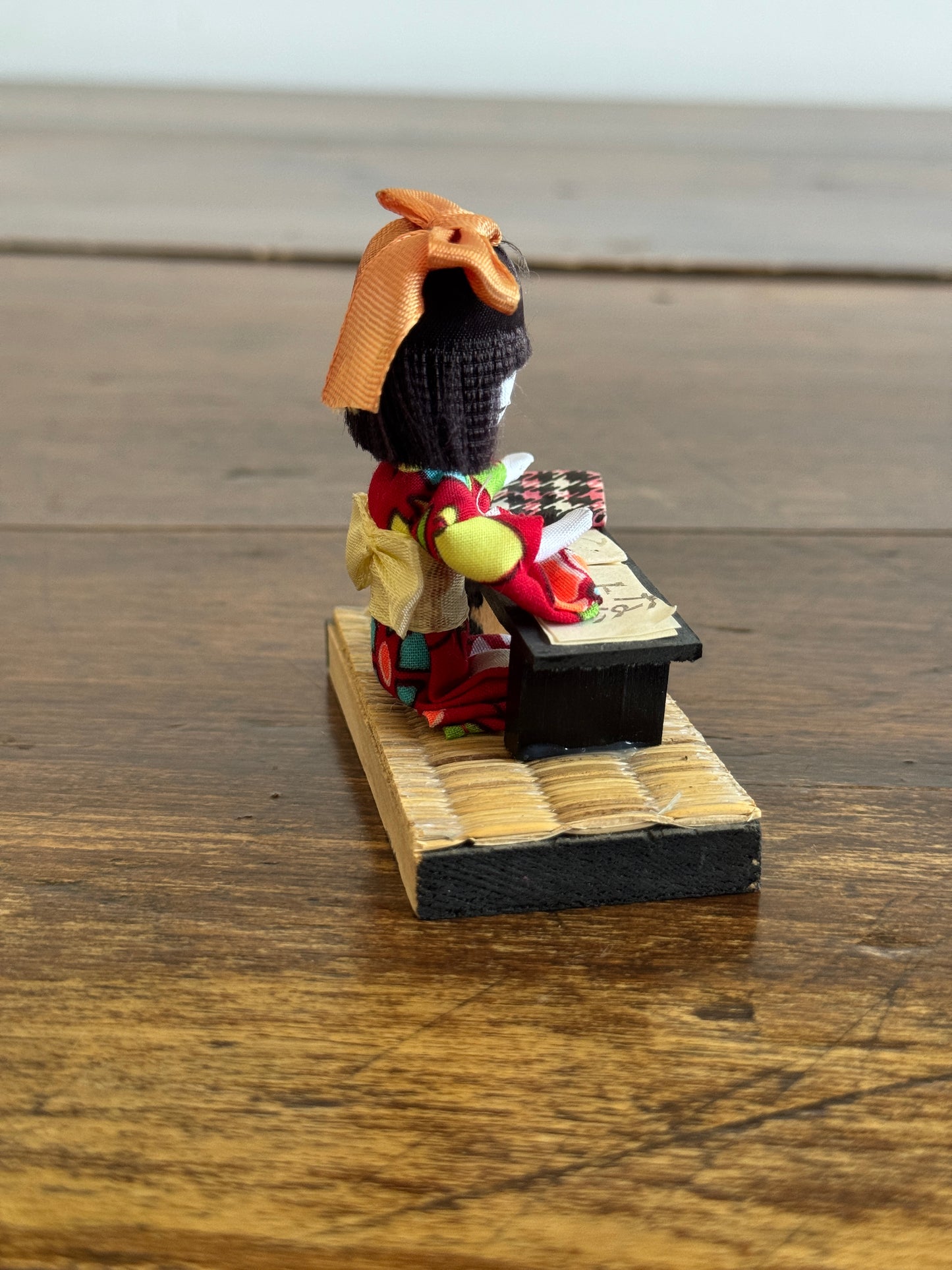 Vintage Japanese Mixed Media Kokeshi Doll on Mat in Learning Environment