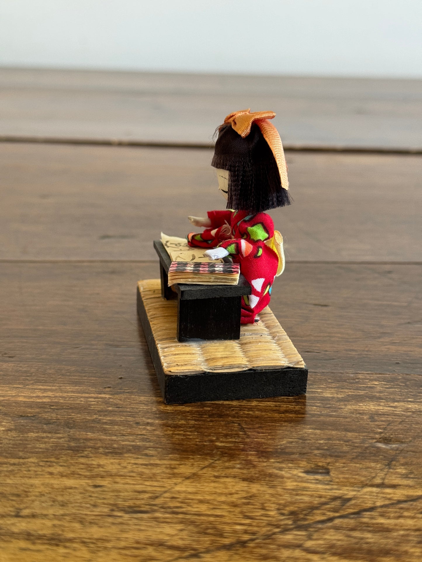 Vintage Japanese Mixed Media Kokeshi Doll on Mat in Learning Environment